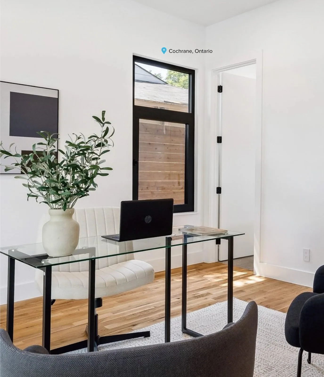Architect working with drawings beside an aluminum window