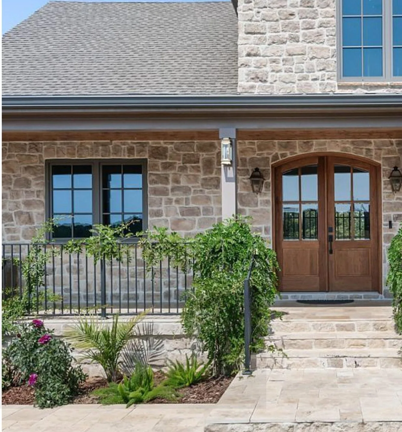 Stone house with slim-profile aluminum windows