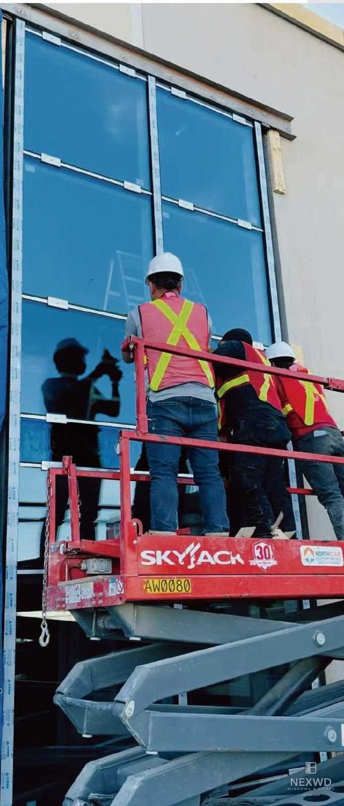Installation from a lift — glazed unit being set